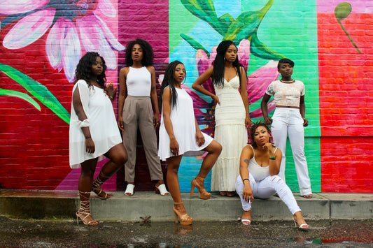 A group of women standing together, smiling